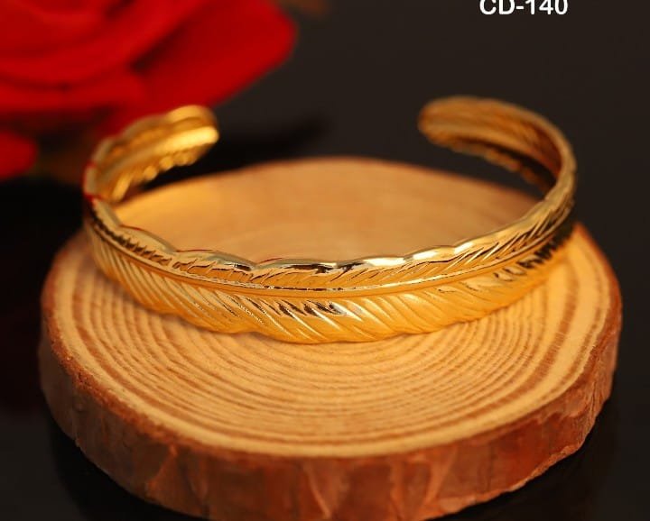 Wide Gold-Tone Feather Embossed Cuff Bangle